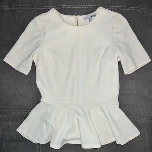 Peplum shirt. Women’s off white blouse, ruffled bottom and zippered back